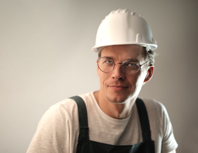 Friendly HVAC contractor ready to service a heating and cooling system